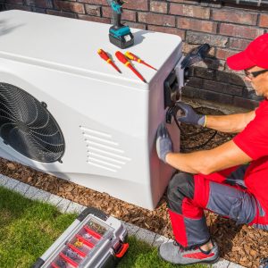 man doing maintenance on HVAC system