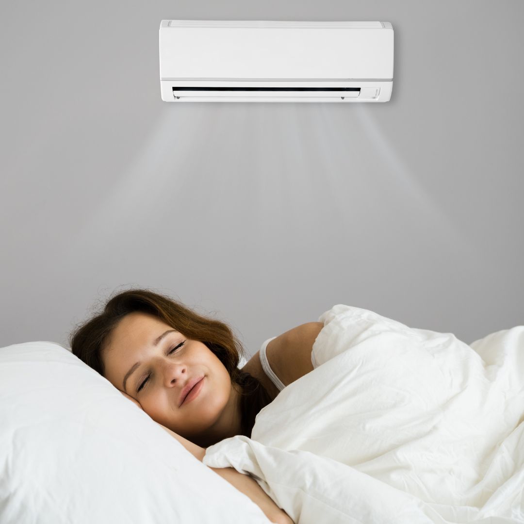 woman sleeping with AC on