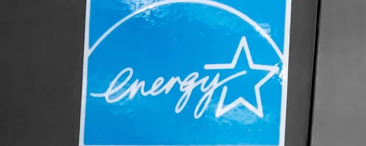 Energy Star label on a black surface, symbolizing energy efficiency certification.